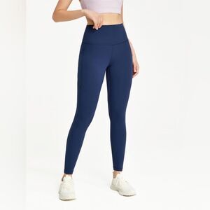 Glowmode 24 inch feather fit high-rise side pocket leggings navy‎ NWT in pkg